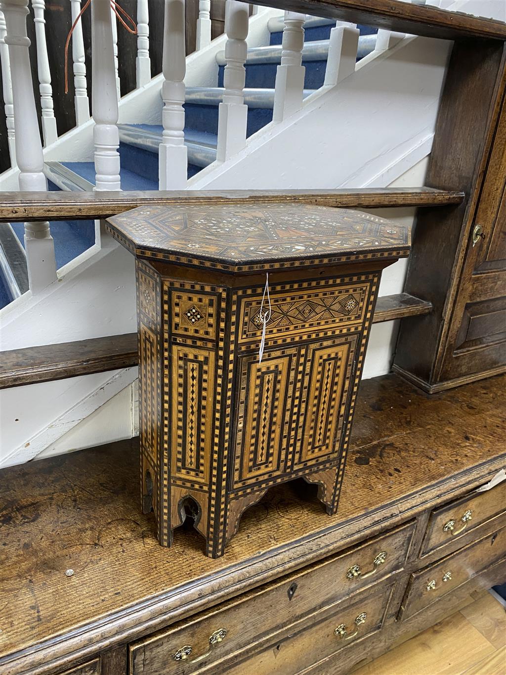A Moorish octagonal mother of pearl inlaid work table, width 50cm, depth 33cm, height 56cm